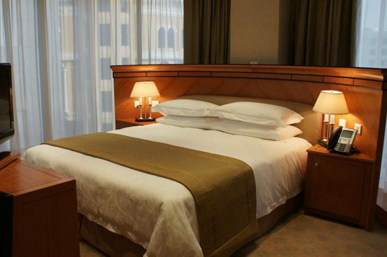 Wiseman Grand Hotel Doha Buitenkant foto A bed