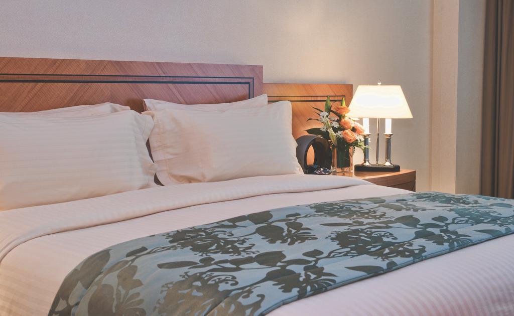 Wiseman Grand Hotel Doha Buitenkant foto A bed runner